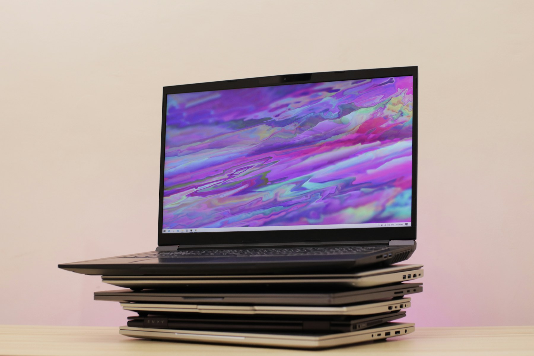 Multiple laptops arranged for refurbished laptop value comparison